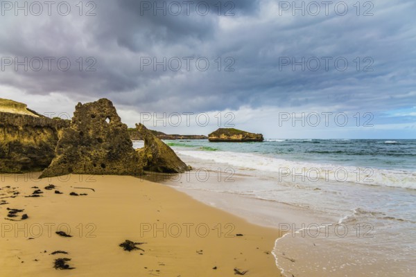 Picturesque seashore, coastal cliffs and a powerful surf of the Pacific Ocean. The Great Ocean Road of Australia. The concept of exotic, active and photo-tourism