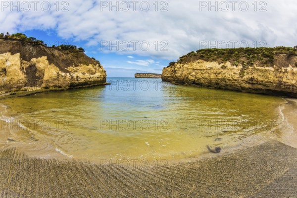 Great Ocean Road of Australia. Picturesque seashore, coastal cliffs and sandy beaches of the Pacific. The concept of exotic, active and photo-tourism