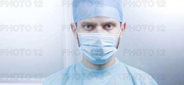 Doctor looking directly at the camera in a clean medical environment