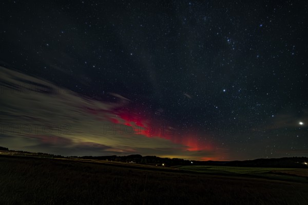 Night sky with auroras over a dark landscape, Bogen, Lower Bavaria