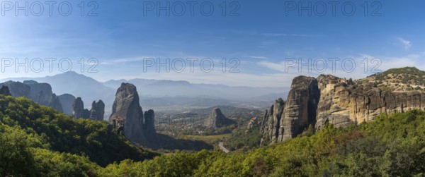 Panorama landscape view of the Meteora rock formations with the Saint Nikolaos monastery