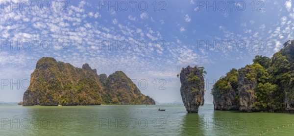 A colorful picture of the beautiful landscape of the James Bond Island and its iconic islet