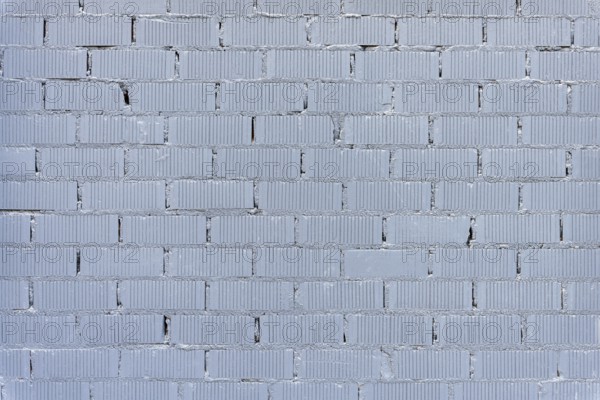 Background consisting of a wall of grey painted bricks