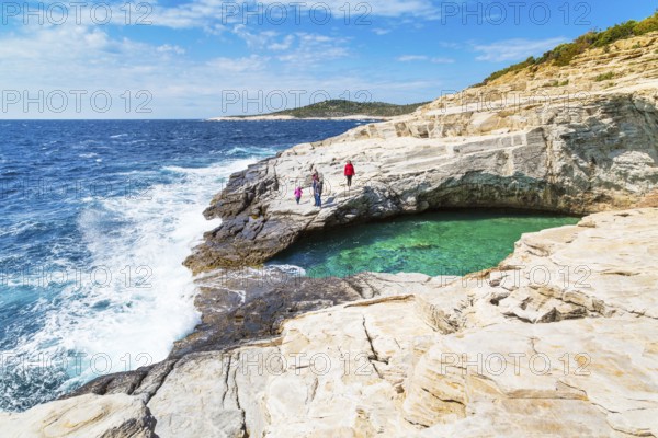 Thassos, Greece, May 2, 2016: People near Giola natural sea water pool located on Thassos island, Greece