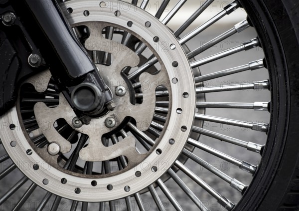 Motorbike front wheel close-up, outdoor on street. bike riding. Close up front wheel of a motorcycle