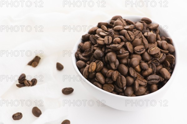 Bowl of caffee beans on a white background