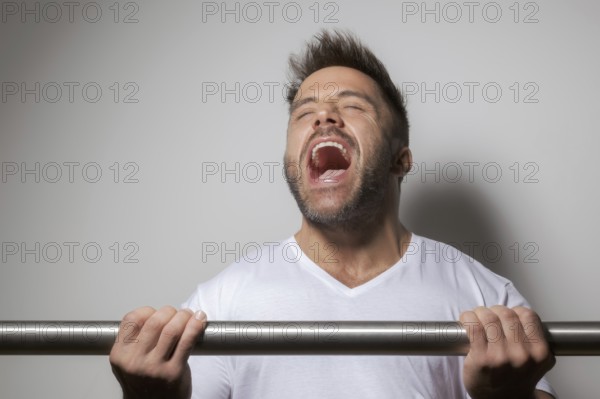 An image of a bearded bodybuilding man