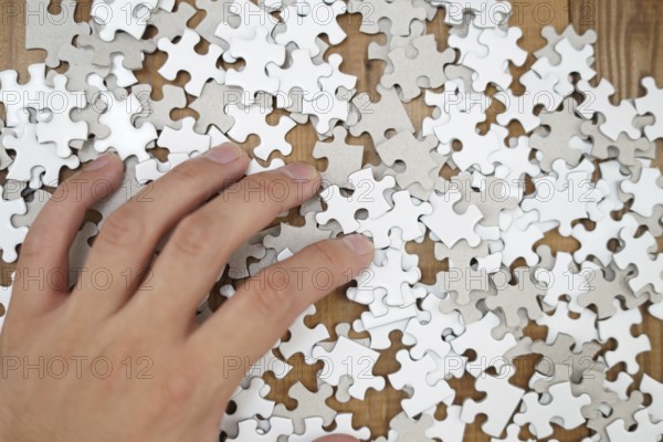 White jigsaw puzzle that has been placed on a desk. Shooting Location: Yokohama-city kanagawa prefecture