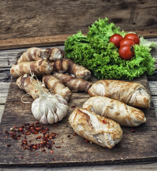 Cooked meat products with spices and tomatoes