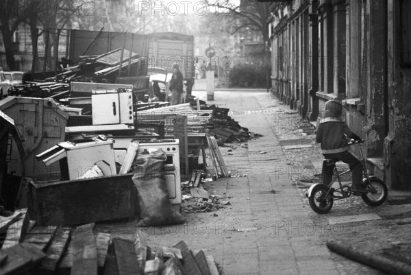 14/03/1982 GDR East Berlin district of Prenzlauer Berg. Scene during renovation work in Lettestrasse. Building rubble and old household appliances are sometimes stored outside the front door for several months. Berlin