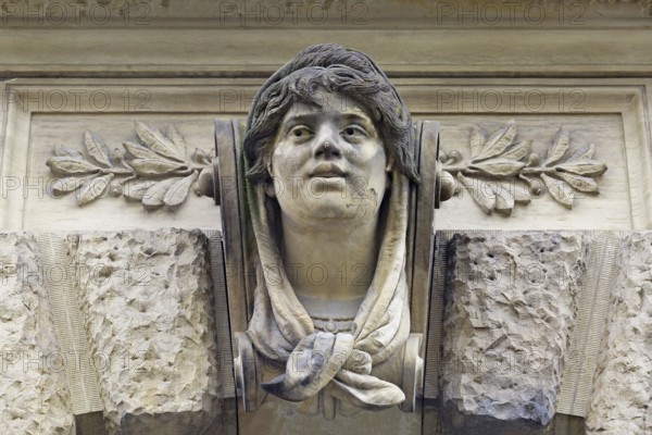 Stone head on a façade