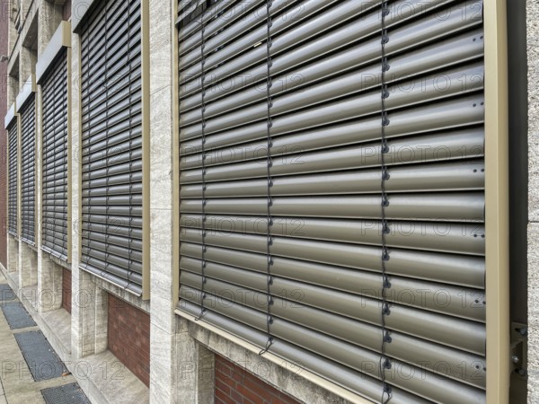 Windows with lowered shutters