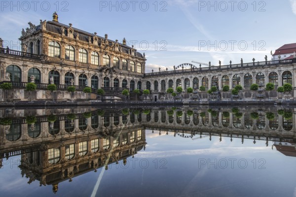 The Dresden Zwinger, a landmark of baroque architecture. Historic buildings in the style of a palace, orangery at sunrise in the morning in the city of Dresden, Saxony, Germany