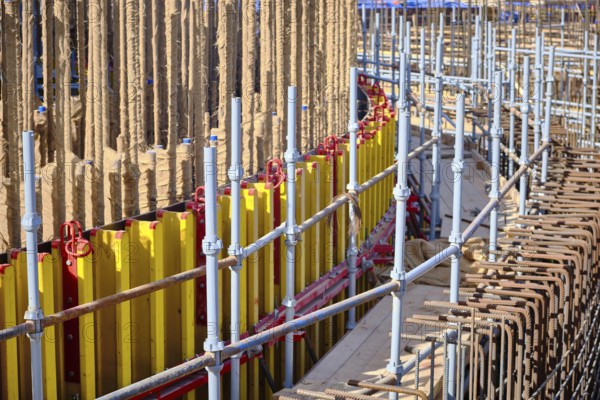 Vertical panel formwork and scaffoldings of reinforced concrete walls under construction. Structures for cast in place reinforced concrete