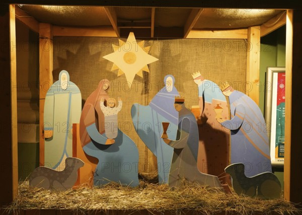 Snowy winter morning and New Year's electrical decorations in the city center, Nativity scene near St. Anne's Church