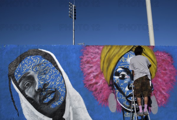 Germany, Berlin, 09.06.2024, Sunday afternoon in Mauerpark, Graffiti Wall (inner wall), Eme Freethinker, at work
