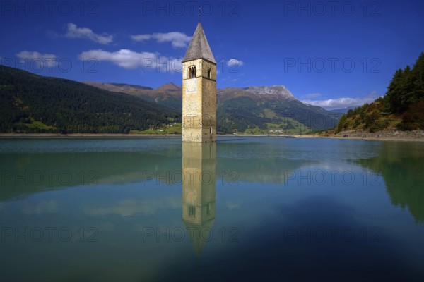 Lake Recshensee with church tower in South Tyrol, Lake Reschen, South Tyrol, Italy