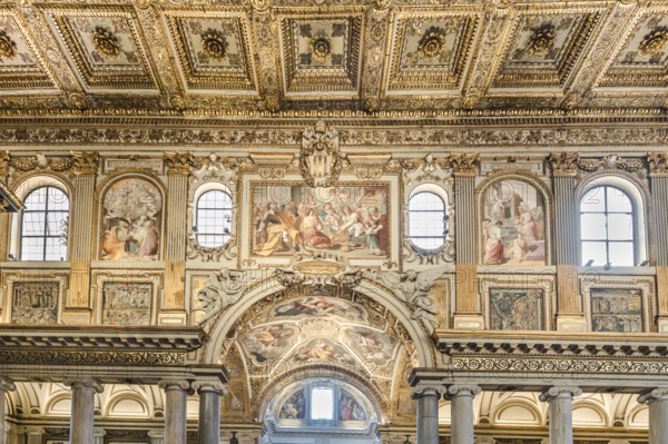 Coffered ceiling of the right aisle with a view into the domed chapel of the capella sistina of the Basilica of Santa Maria Maggiore in Rome, Italy