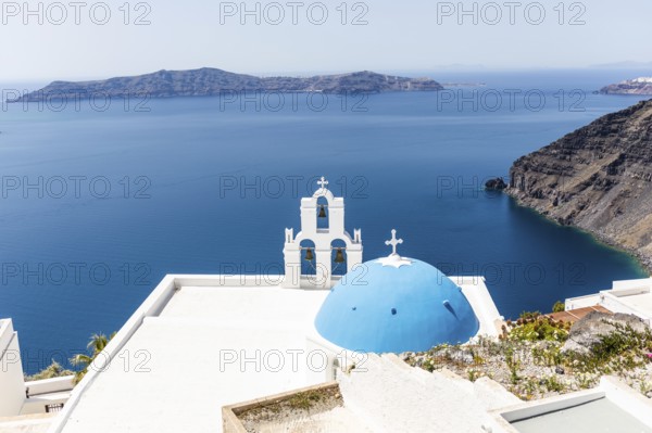 Blue church dome, bell tower, view of the caldera, Thirassia Island, Santorini, Cyclades, Greece
