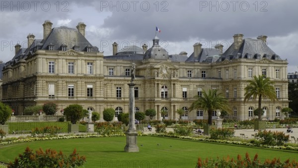 Jardin du Luxembourg with lawns, borders and planters. The Palais du Luxembourg in the background. Landscape format. Jardin du Luxembourg with lawns, borders and plant pots. Horizontal format