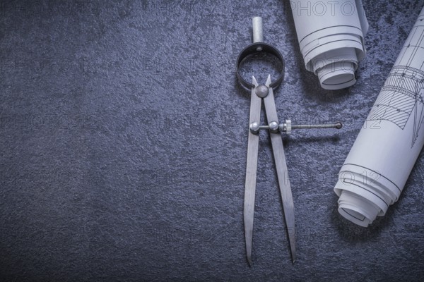Construction drawings pair of compasses on black background maintenance concept