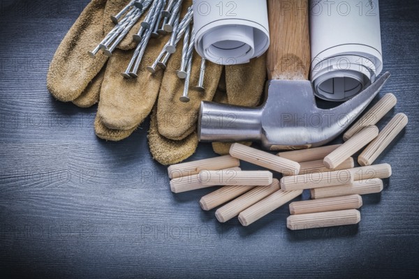 Dowels hammer blueprints nails gloves