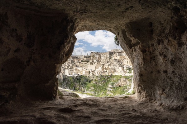 Scenic view of historic downtown with its cathedral, photo taken from a cave house, Italy