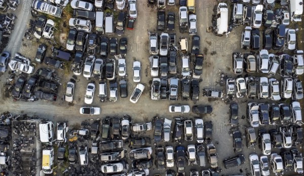 Aerial view of junkyard with discarded broken cars. Recycling of old vehicles