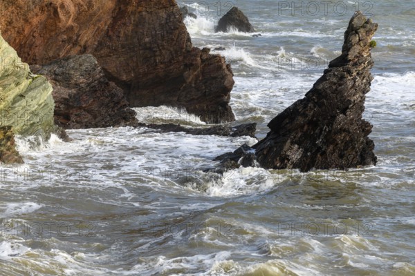 Breaking waves on a rock in the Atlantic Ocean on the French coast in summer