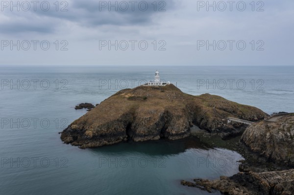 Aerial landscape view of the Pembrokeshire coast with the historic Strumble Head Lighthouse