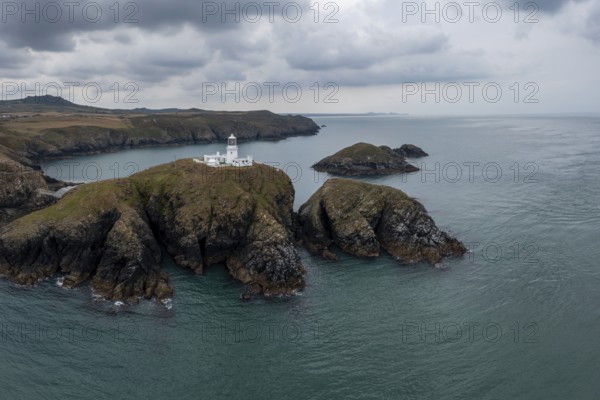 Aerial landscape view of the Pembrokeshire coast with the historic Strumble Head Lighthouse