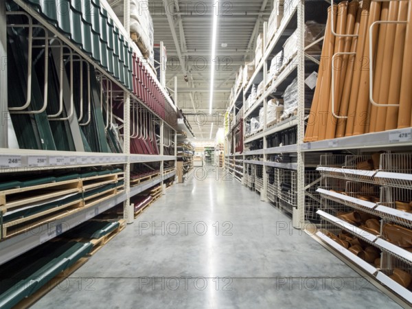 Store for home improvement and DIY. Warehouse aisle of building materials in industiral store. Shallow DOF
