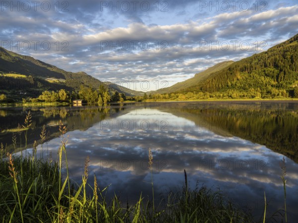 Evening light, forest landscape and clouds reflected in the lake, Gaishorner See, near Gaishorn am See, Styria, Austria