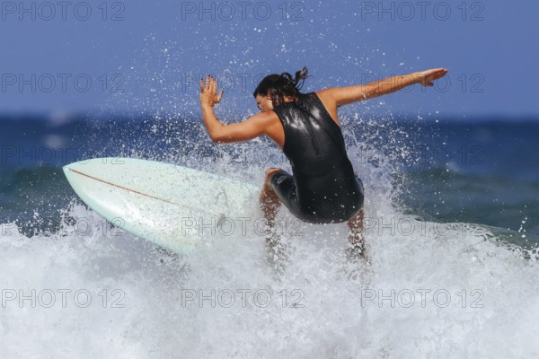 BELLS BEACH, AUSTRALIA, JANUARY 26 2024: Surfers in action at the iconic Bells Beach on a warm summer's afternoon near Torquay, Victoria, Australia