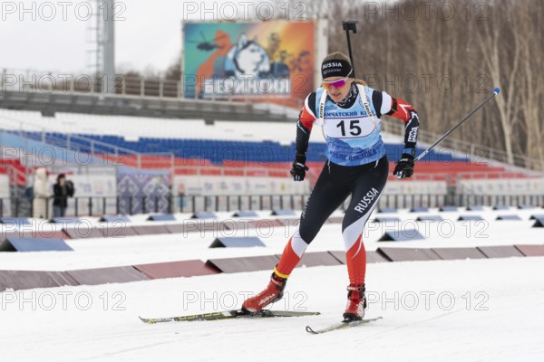 Sportswoman biathlete Eremeeva Elizaveta Kamchatsky Krai skiing on distance biathlon complex. Open regional youth biathlon competitions East Cup. Kamchatka Peninsula, Russian Far East, Apr 12, 2019
