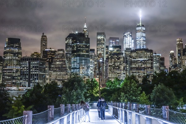 Night view and the people of New York Manhattan. Shooting Location: New York, Manhattan