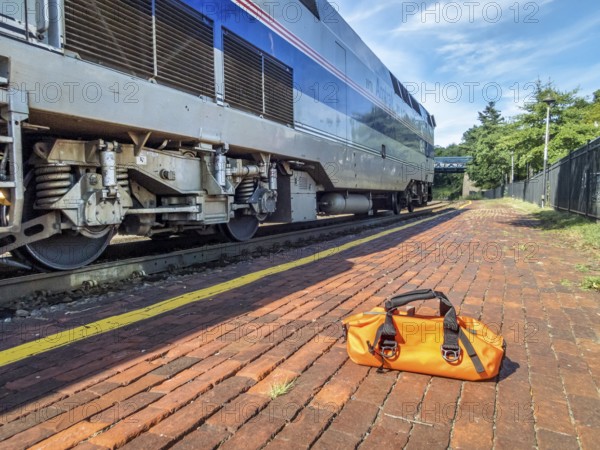 Kirkwood, Mo, USA - August 12, 2017: Morning Amtrak train, River Runner, from St Louis to Kansas City arrives at Kirkwood station