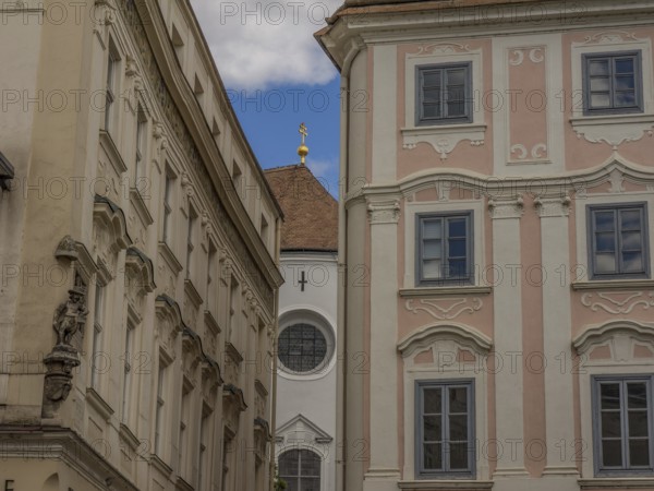 Historic buildings with ornate facades in a narrow alleyway in the historic town centre, Dürnstein, Wachau, Danube, Austria