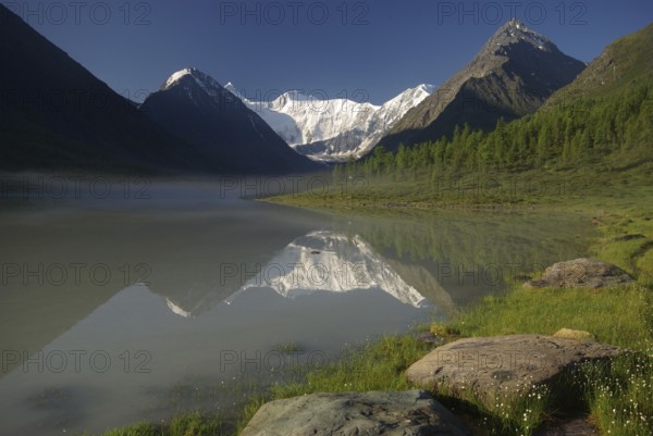 Beautiful mountain landscape near the lake. Mountain Lake. Kind of mountainous terrain and the water in the valley