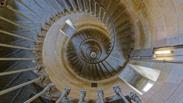 Interior spiral staircase of the Whale Lighthouse made of stone, showcasing intricate railing and architectural detailing, Whale Lighthouse, Saint-Clément-des-Baleines, Island of Re, Charente-Maritime, France