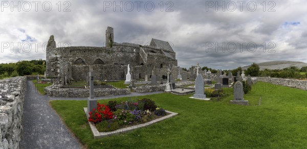 Ballyvaughan, Ireland, 28 July, 2022: panorama view of the historic 13th-century Corcomroe Abbey and cemetery in County Clare
