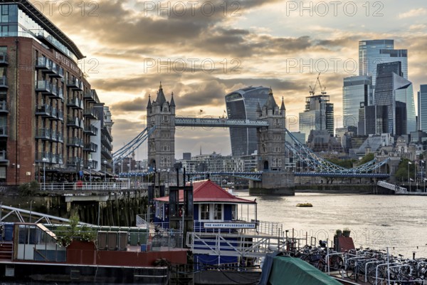 View over the Thames with Tower Bridge and the skyline in the evening light, London, England, Great Britain