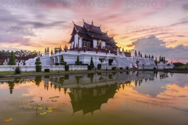 Royal Pavilion and its reflection in pond at Royal Flora Ratchaphruek park. Colorful sky in the morning. Chiang Mai, Thailand