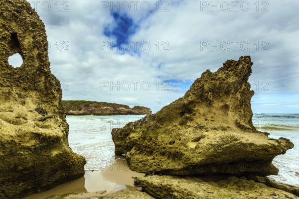 Picturesque seashore, coastal cliffs and surf of the Pacific Ocean. The Great Ocean Road of Australia. The concept of exotic, active and photo-tourism