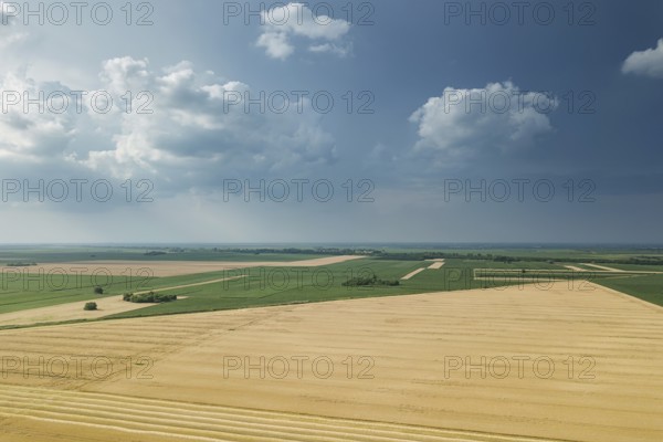 Aerial view of agricultural fields. Cloudy countryside, Aerial view