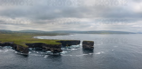 A drone panorama landscape of the Downpatrick Head sea stack and cliffs and coastline of northern County Mayo in Ireland