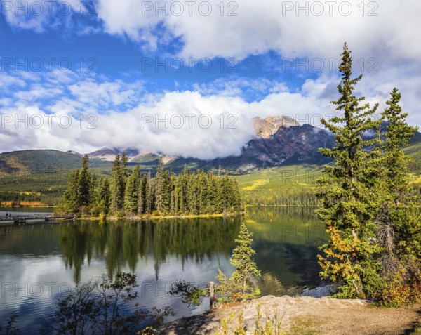 The clear autumn morning in Jasper National Park, Canada. Charming little island in the Pyramid Lake