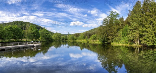 View at a lake in the Spiesswoogtal valley near the German village Fischbach bei Dahn in the Rhineland-Palatinate View at a lake in the Spiesswoogtal valley near the German village Fischbach bei Dahn in the Rhineland-Palatinate