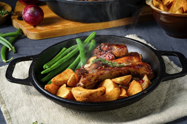 Schweinefleisch mit Bohnen und Quartierkartoffeln