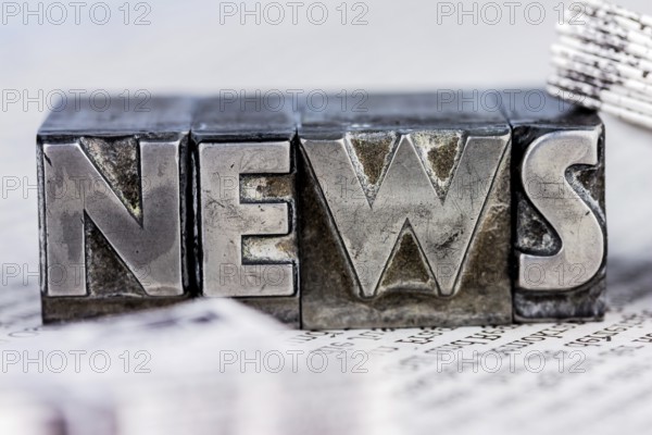 The word News was written in lead letters. Symbol photo for newsletters, newspapers and Information Austria